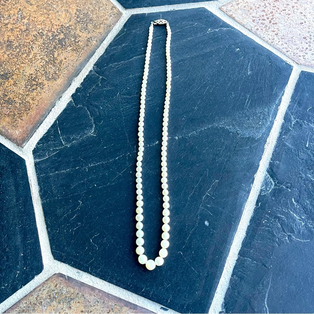 Graduated Cultured Pearl necklace 18” long 10kt. White gold clasp